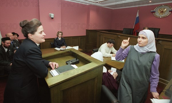 Moscow, russia, march 5 2003, expert irina bychenkova (l) and a declarant zulfiya fatkhulina (r) pictured talking as the russian supreme court has turned down a complaint on wednesday lodged by severel women from tatarstan who demanded that moslem women be allowed to present photographs for passports with their head scarves on in accordance with a moslem tradition, (photo itar-tass/ yuri mashkov)  .