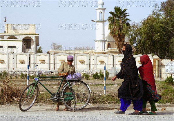 Jalalabad, afghanistan, march 16 2003, in a street of jalalabad, the capital of afghanistan's nangarhar province located not far from the border with pakistan, at present, this is one of the country's most busy cities.