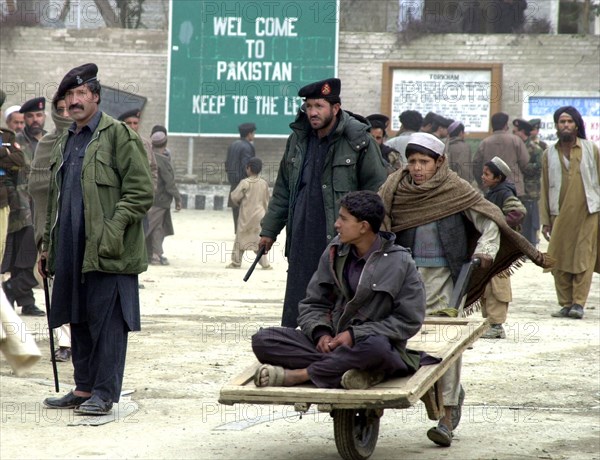 afghanistan, march 17 2003, thousands of people cross daily the border between afghanistan and pakistan through tourkham border crossing point (in pic), there are many families that are still separated as the result of flood of refugees from afghanistan.
