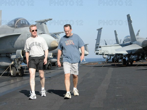 Uss theodore roosevelt aircraft carrier, mediterranean sea, march 25, servicemen on a stroll (in pic) on the flight deck of uss theodore roosevelt lying in the eastern part of the mediterranean sea.