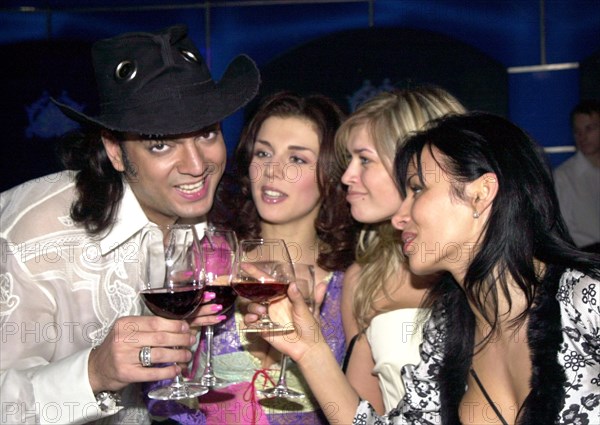 Moscow, russia, april 25 2003, popular singer filipp kirkorov (l) and anna sedakova (l-r), vera brezhneva and nadezhda granovskaya of the via gra group at yesterday's presentation of new album titled 'stop! shooting over!' .