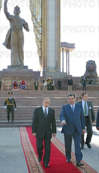 Russian president vladimir putin (l) and tajik president emomali rakhmonov (r) pictured following a wreath laying ceremony at the memorial 'national accord and reconciliation in tajikistan' with the monument to ismoil somoni, founder of the first tajik state, on saturday, april 26, 2003.