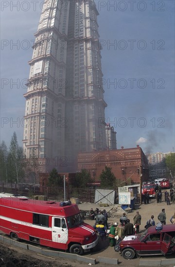 Caption: tas 17, moscow, russia, may 12, 2003, firemen pictured extinguishing the fire that broke out in a garage at the territory of the 'alye papusa' dwelling house ,on monday, (photo itar-tass/ lyudmila pakhomova)  .