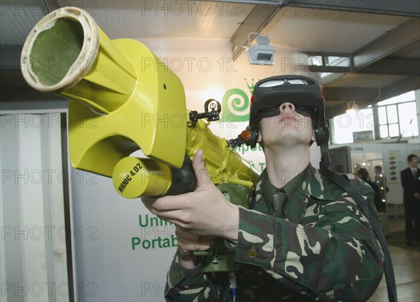 Caption: tas 34, minsk, belarus, may 13, 2003, an electronic computerized simulator of the portable aa missile complex (in picture) developed by the beltechexport firm is displayed at the 'milex-2003' international exhibition of armaments and military materiel opened on tuesday here, (photo itar-tass/ viktor tolochko) .