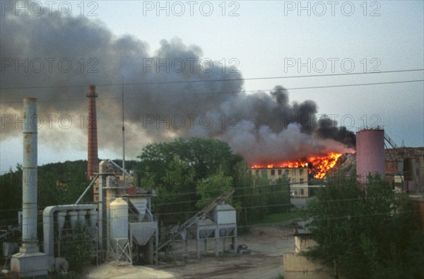 Moscow region, russia, smoke of a burning dump at the asphalt plant in domodedovo, yesterday cloaked the whole town, the ecological situation in moscow suburbs keeps deteriorating, 08,2003.