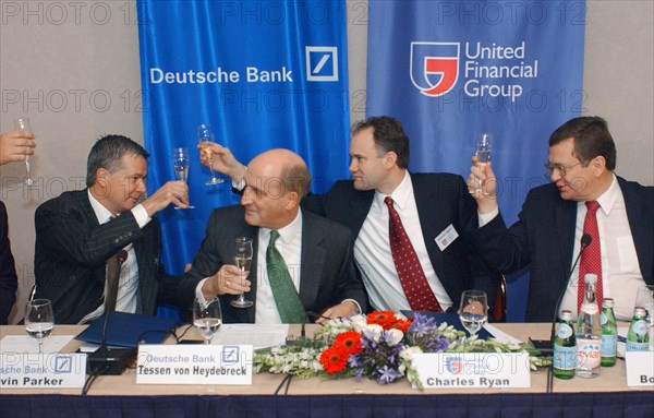 (l-r) kevin parker, tessen von heydebreck (deutsch bank ag) charles rhine and boris fedorov (fyodorov) (united financial group) celebrating signing business cooperation agreement in hotel 'balchug-kempinsky' on thursday, 11/2003, moscow.