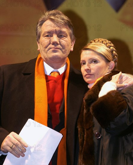 Ukraine election crisis 2004, opposition presidential candidate viktor yushchenko (left) and his companion yulia timoshenko called on the participants in a rally to assault the presidential administration's building if the parliament doesn't satisfy the opposition's demands, kiev, ukraine, november 23 2004.