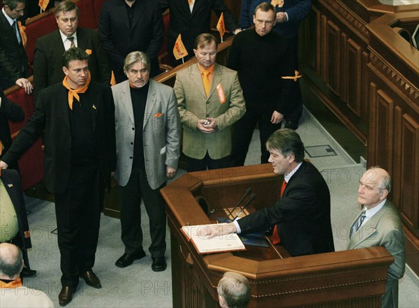 Ukraine election crisis 2004, after a plenary sitting of the supreme rada, opposition leader viktor yushchenko mounted the parliamentary rostrum and declared himself president of ukraine and took a symbolic oath of office swearing on a bible, kiev, ukraine, november 24 2004.