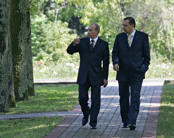 Turkish prime minister recep erdogan (right) and russian president vladimir putin seen during a stroll in 'bocharov ruchei' presidential residence prior to their news conference on july 18, 2005, sochi, russia.