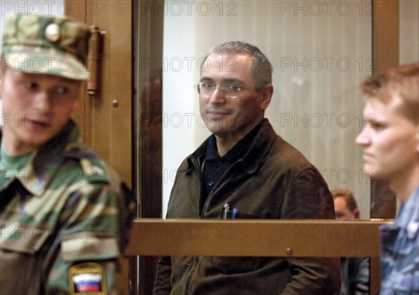Former head of yukos mikhail khodorkovsky leaving the courtroom after hearing that the moscow city court has reduced his and p, lebedev's sentences from 9 to 8 years of imprisonment, moscow, russia, september 22, 2005.