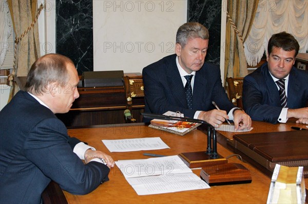 President vladimir putin (l), newly appointed first deputy prime minister dmitry medvedev (r) and the tyumen region’s former governor sergei sobyanin, who takes over medvedev’s previous post as presidential administration head, appear during the cabinet meeting in the kremlin, mocow, russia, 11/05.
