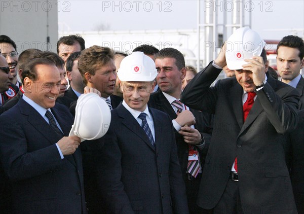 Italian prime minister silvio berlusconi, russian president vladimir putin and prime minister of turkey recep tayyip erdogan get ready to light a symbolic torch for the blue stream undersea gas pipeline which carries natural gas from russia to turkey, samsun, turkey, november 17 2005.