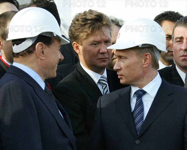 Italian prime minister silvio berlusconi, gazprom chairman alexei miller and russian president vladimir putin get ready to light a symbolic torch for the blue stream undersea gas pipeline which carries natural gas from russia to turkey, samsun, turkey, russia, november 17 2005.