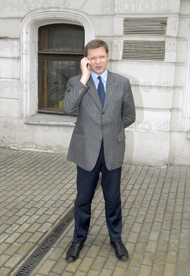 State duma deputy vladimir ryzhkov talks on his mobile phone before the other russia organization’s forum in the central house of journalists, moscow, april 19, 2007, moscow, russia.