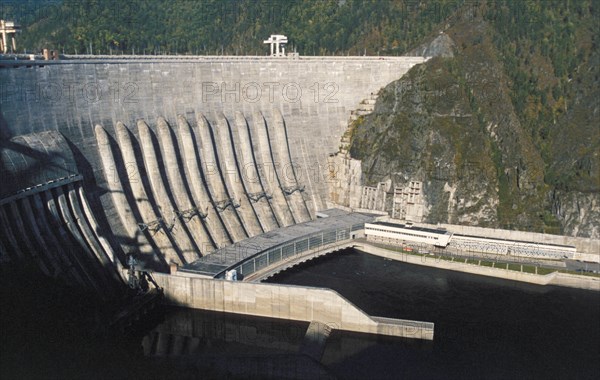 The sayano-shushenskaya dam and hydroelectric power station on the yenisey river in the republic of khakassia, russia, at full capacity, it's the world's biggest power generator.