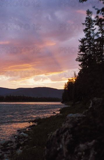 Sunset on the manya river in the ural region of siberia, october 2000.