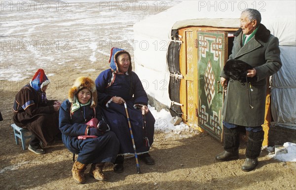 Elderly buryat people outside of their yurt in the village of urdaga in the aginsk buryat autonomous republic, siberia, russia.