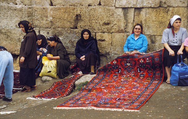 Women selling rugs in daghestan, russia.