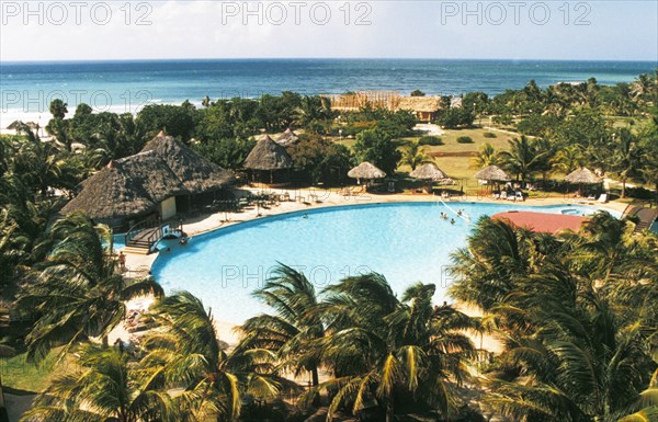 A swimming pool on the grounds of a resort hotel on varadero beach in cuba.