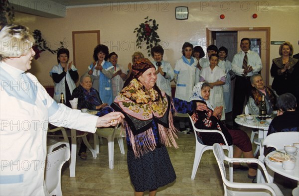 Antonina savelova celebrating her 100th birthday at a nursing home in moscow, russia, april 1998.