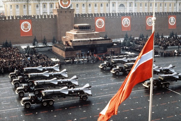 Trucks bearing sa-1 and sa-2 surface -to-air missiles during a military parade in red square celebrating the 65th anniversary of the great october socialist revolution, november 7, 1982, moscow, ussr.