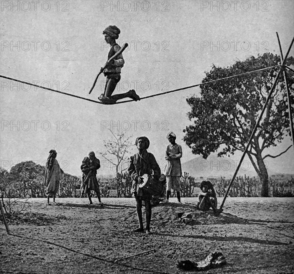 Historical Geography. 1900. India. Balancing feat of a wandering acrobat