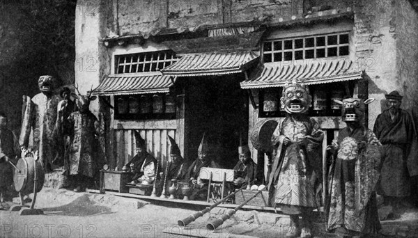 Historical Geography. 1900. India. Masked Lamas costumed for the devil dance, a religious observance sometimes lasting three days