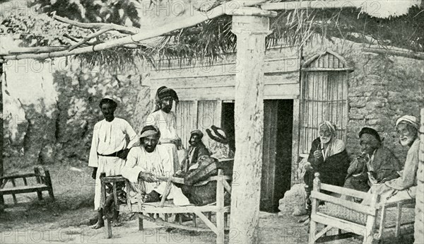 Historical Geography. 1900. Iraq. Arabs at ease outside a cafe' in the valley of the Tigris.