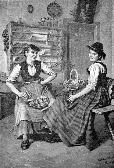 Two Women At The Kitchen Work