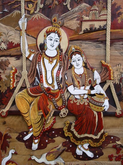 Radha and Krishna enjoying a swing