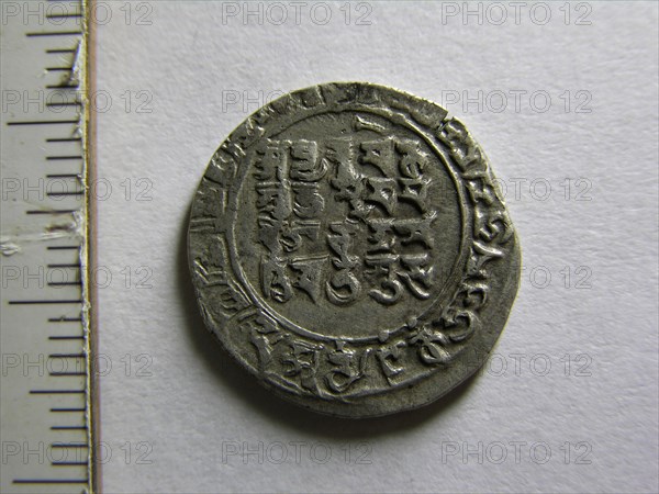 The coin has Kalima in Arabic on obverse and same has been translated in Devanagari script and Sanskrit language on the reverse Mahmudpur (Lahore)