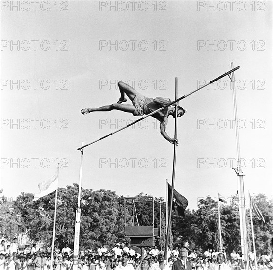 South Asian Indian athlete performing Pole Vault