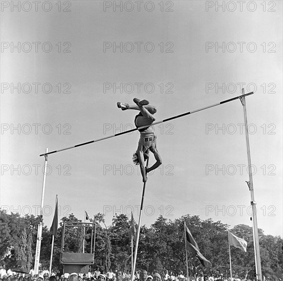 South Asian Indian athlete performing Pole Vault