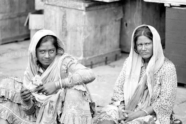 Two woman sitting on the steps