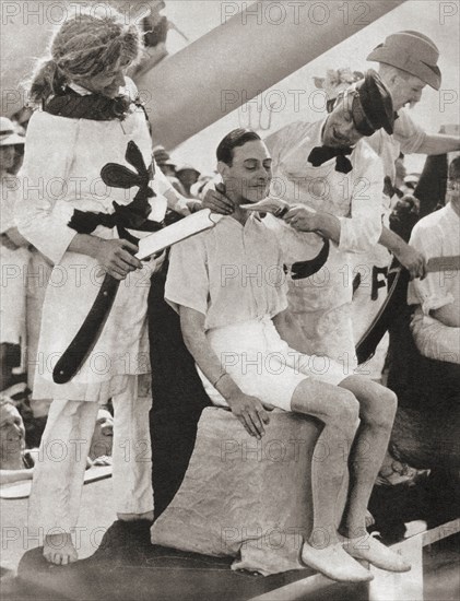 The Duke of York suffers the line-crossing ceremony aboard The Renown in 1927