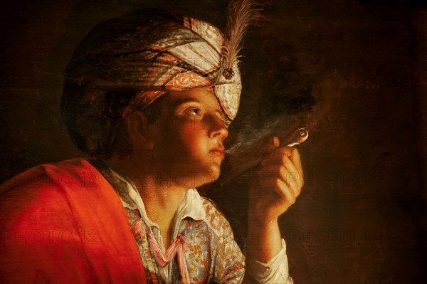 Young man smoking a pipe