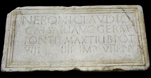 Stone plaque dedicated to emperor Nero (Nero Claudius Caesar Augustus Germanicus)  (37-68 AD) honouring his person and lists his titles: Pontifex Maximus, Tribune, Consul, Emperor and Father of the Homeland
