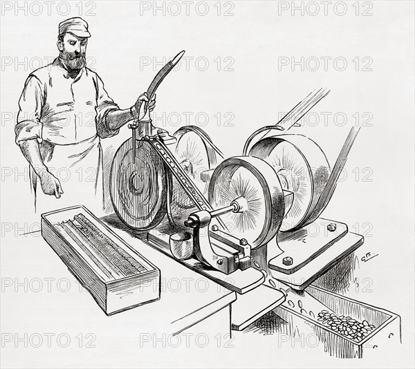 A worker at a coin rimming machine, the Royal Mint, London,