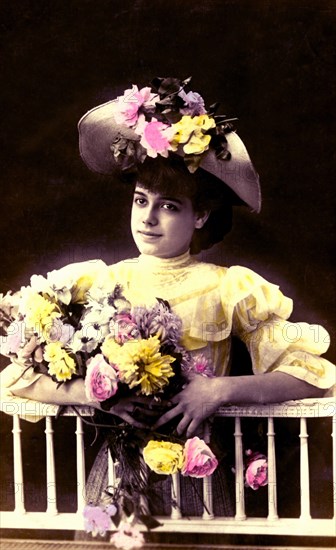 Nice girl with flowers bouquet