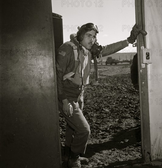 Portrait of Tuskegee airman Edward M. Thomas, standing