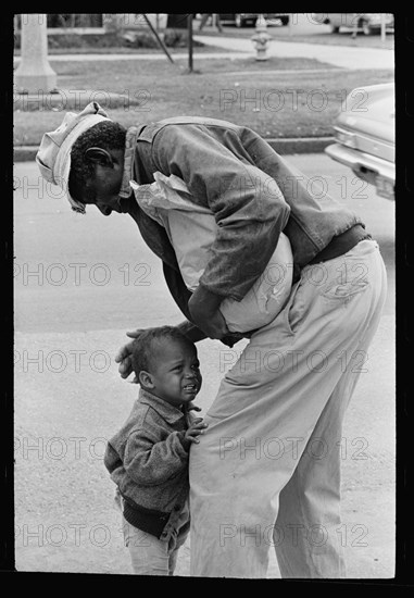 Old man comforting child