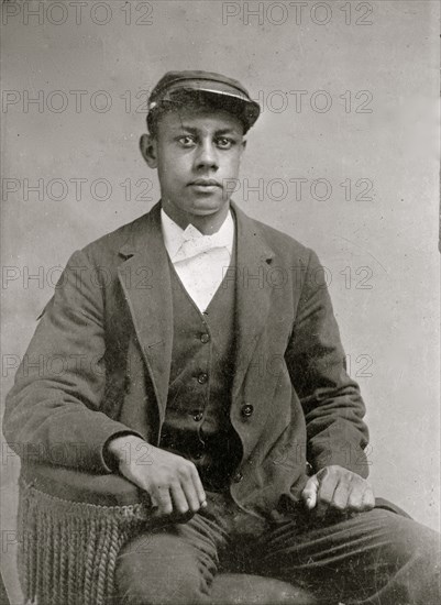 Portrait of an African American man, seated