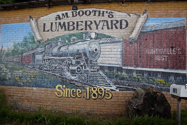 A.M. Booth's lumberyard mural in of train