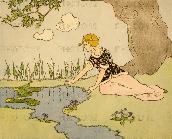 Girl sits by pond and addresses a frog