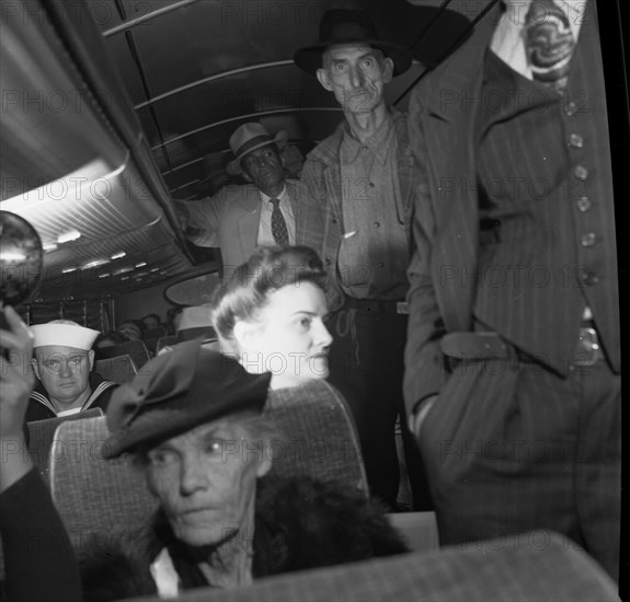 A Greyhound bus trip from Louisville, Kentucky, to Memphis, Tennessee, and the terminals. Passengers standing in aisles on Memphis-Chattanooga Greyhound bus