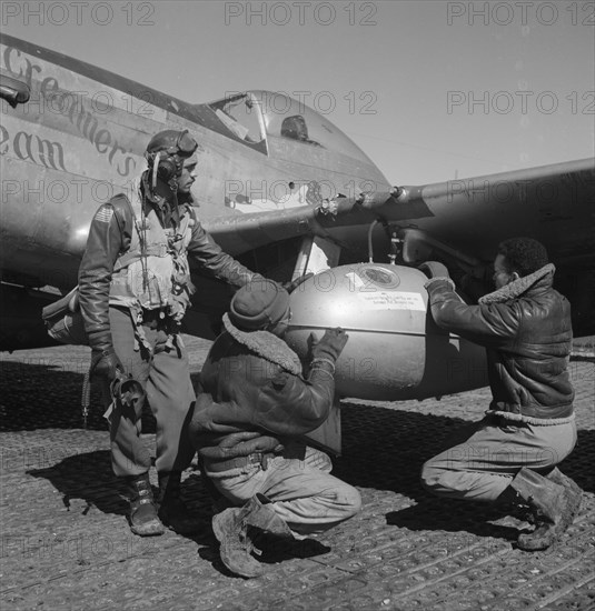 Edward C. Gleed and two unidentified Tuskegee airmen, Ramitelli, Italy, March 1945]