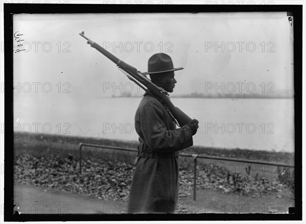 African American soldier drills at shoulder arms