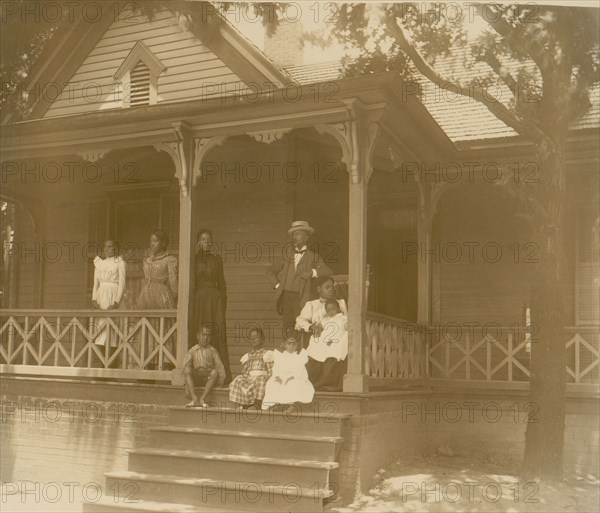 Home of an African American lawyer, Atlanta, Georgia, with men, women, and children posed on porch of house