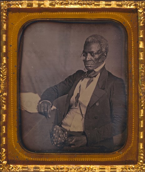 John Hanson, three-quarter length portrait, three-quarters view, wearing glasses, seated at desk