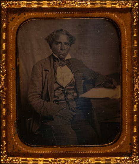 Edward Morris, three-quarter length portrait, full face, seated at desk